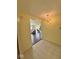 Inviting entryway with tiled floor and decorative chandelier; an open view to the living room with nice hardwood floors at 1639 Park Castle Way, Indianapolis, IN 46229