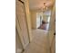Hallway with tile flooring and chandelier leading to a living room at 1639 Park Castle Way, Indianapolis, IN 46229