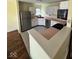 Bright kitchen with white cabinets, stainless steel appliances and tile flooring, with access to the dining area at 1639 Park Castle Way, Indianapolis, IN 46229
