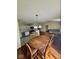 Open concept space with a view of the kitchen, dining area, and living room; hardwood floors throughout at 1639 Park Castle Way, Indianapolis, IN 46229