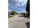 A quiet residential street featuring well-kept homes and landscaped yards under a blue sky at 1639 Park Castle Way, Indianapolis, IN 46229