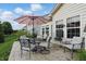 Outdoor patio with stylish seating and umbrella, perfect for enjoying sunny days and evenings at 1663 Sweetgum Dr, Greenwood, IN 46143