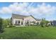 Spacious backyard with a patio, perfect for outdoor gatherings and summer barbecues at 1663 Sweetgum Dr, Greenwood, IN 46143