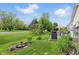 Lush backyard with patio and grill area, perfect for outdoor cooking and summer gatherings at 1663 Sweetgum Dr, Greenwood, IN 46143