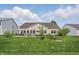 Well-maintained backyard with lush lawn and patio, ideal for relaxing and entertaining at 1663 Sweetgum Dr, Greenwood, IN 46143