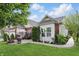 Enjoy the outdoor patio with chairs and a fire pit, surrounded by green landscaping at 1663 Sweetgum Dr, Greenwood, IN 46143