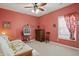 Bedroom featuring a day bed, dresser, red walls, and decor at 1663 Sweetgum Dr, Greenwood, IN 46143