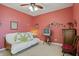 Bedroom featuring a day bed, dresser, red walls, and decor at 1663 Sweetgum Dr, Greenwood, IN 46143
