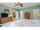 Spacious bedroom featuring a ceiling fan, neutral walls, and decorative furniture at 1663 Sweetgum Dr, Greenwood, IN 46143
