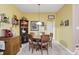 The dining area offers a wood table with seating for six, overhead lighting, and neutral-toned walls at 1663 Sweetgum Dr, Greenwood, IN 46143
