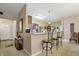 Kitchen island with bar seating, flowing into the dining area, great for entertaining and casual dining at 1663 Sweetgum Dr, Greenwood, IN 46143