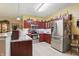 Spacious kitchen with stainless steel appliances, ample counter space, and a convenient layout for cooking at 1663 Sweetgum Dr, Greenwood, IN 46143