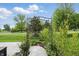 The yard has a charming stone walkway leading to a decorative garden arch, perfect for a tranquil retreat at 1663 Sweetgum Dr, Greenwood, IN 46143