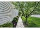 Discover this home with a charming stone walkway and colorful flower beds, adding to the property's allure at 1663 Sweetgum Dr, Greenwood, IN 46143