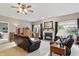 Relaxing living room featuring a fireplace, comfortable recliners, and plenty of natural light at 1663 Sweetgum Dr, Greenwood, IN 46143