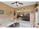 Open-concept living area with seamless transition to sunroom with comfortable seating and natural light at 1663 Sweetgum Dr, Greenwood, IN 46143