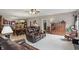 Inviting living room with plush carpeting, comfortable seating, and an open layout to the dining area at 1663 Sweetgum Dr, Greenwood, IN 46143