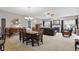 Open concept living space with dining area, fireplace, and comfortable seating at 1663 Sweetgum Dr, Greenwood, IN 46143