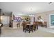Open concept living space with dining area, fireplace, and comfortable seating at 1663 Sweetgum Dr, Greenwood, IN 46143