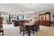 Open concept living space with dining area, fireplace, and comfortable seating at 1663 Sweetgum Dr, Greenwood, IN 46143