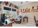 Office space featuring a large window, a sitting chair, and decor at 1663 Sweetgum Dr, Greenwood, IN 46143