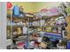 This walk-in pantry has ample shelving for plenty of storage and is well-stocked with items at 1663 Sweetgum Dr, Greenwood, IN 46143