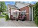 Enjoy outdoor living with this patio featuring cozy seating and a colorful umbrella, great for entertaining at 1663 Sweetgum Dr, Greenwood, IN 46143