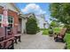 Enjoy this outdoor patio with cozy seating and colorful umbrella, ideal for relaxation and social gatherings at 1663 Sweetgum Dr, Greenwood, IN 46143