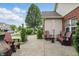 The patio has comfortable seating and a charming umbrella, perfect for relaxing and enjoying outdoor gatherings at 1663 Sweetgum Dr, Greenwood, IN 46143