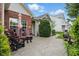 This home features a cozy patio with comfortable seating and an umbrella for outdoor relaxation and entertainment at 1663 Sweetgum Dr, Greenwood, IN 46143