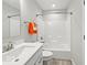 Bright bathroom featuring white fixtures and a combined tub and shower at 16739 Cattle Hollow Ln, Noblesville, IN 46060