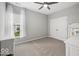 Cozy bedroom features neutral walls and carpet, a double closet, large window and furniture, making it move-in ready at 16739 Cattle Hollow Ln, Noblesville, IN 46060