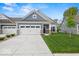 Charming single-Gathering home featuring an attached two-car garage and well-maintained landscaping at 16739 Cattle Hollow Ln, Noblesville, IN 46060