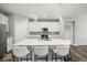Modern kitchen with white cabinets, stainless steel appliances, and a large center island with seating at 16739 Cattle Hollow Ln, Noblesville, IN 46060