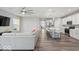 Inviting living area with a sectional sofa, hardwood floors, and an open layout to the kitchen at 16739 Cattle Hollow Ln, Noblesville, IN 46060