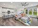 Comfortable living space with a large sofa, modern lighting, and an open floor plan at 16739 Cattle Hollow Ln, Noblesville, IN 46060
