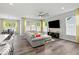 Stylish living room with hardwood floors, ample natural light, and a large entertainment center at 16739 Cattle Hollow Ln, Noblesville, IN 46060