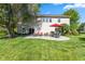 Spacious backyard with a patio, grill, outdoor dining set, and a lush green lawn at 1783 Trillium Ct, Avon, IN 46123