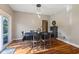 Inviting dining room featuring hardwood floors and a stylish light fixture above the table at 1783 Trillium Ct, Avon, IN 46123