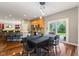 Bright dining room with wood floors, table, and backyard views through sliding glass door at 1783 Trillium Ct, Avon, IN 46123