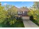 Aerial view of a well-maintained two-story home with a brick and siding exterior and manicured lawn at 1783 Trillium Ct, Avon, IN 46123