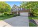 Charming two-story home with a brick and siding exterior, front porch, and a spacious driveway at 1783 Trillium Ct, Avon, IN 46123