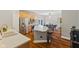 Bright kitchen with stainless appliances, central island, and dining area beyond at 1783 Trillium Ct, Avon, IN 46123