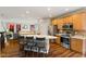 Spacious kitchen with a center island, stainless steel appliances, and wood cabinets at 1783 Trillium Ct, Avon, IN 46123