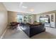 Spacious living room featuring a large comfortable couch, large windows and a piano at 1783 Trillium Ct, Avon, IN 46123