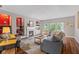 Inviting living room with fireplace, large windows, built-in shelving, and comfortable seating at 1783 Trillium Ct, Avon, IN 46123