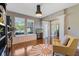 Bright living room featuring hardwood floors, a large window, and an arched doorway at 1783 Trillium Ct, Avon, IN 46123
