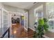 Office space featuring French doors, hardwood floors, and ample natural light from large windows at 1783 Trillium Ct, Avon, IN 46123