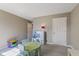 Neutral room with toys, carpet flooring and a door to the hallway at 1783 Trillium Ct, Avon, IN 46123