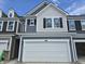 New two-story townhouse featuring gray wood and shingle siding and a two-car garage at 18763 Moray St, Westfield, IN 46074